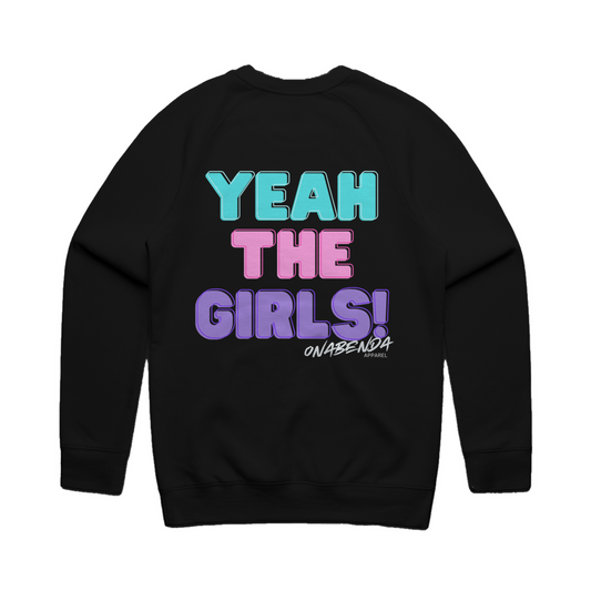 A black crewneck sweatshirt with the text 'YEAH THE GIRLS!' printed on the front in bold letters, featuring a mix of pink and blue colors.