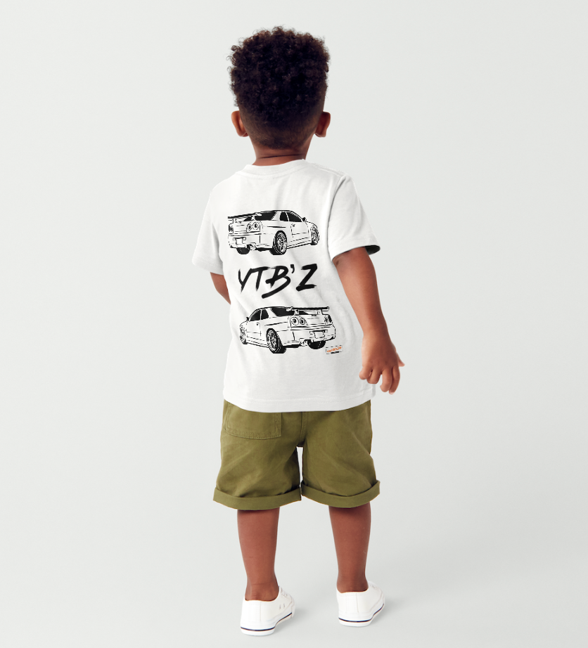 Child wearing a white t-shirt with graphic designs and text, standing against a plain background
